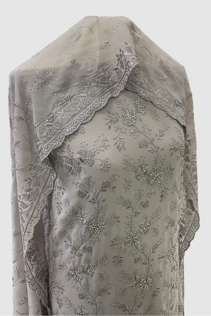 Lillac embroidered fabric on a mannequin in a store setting