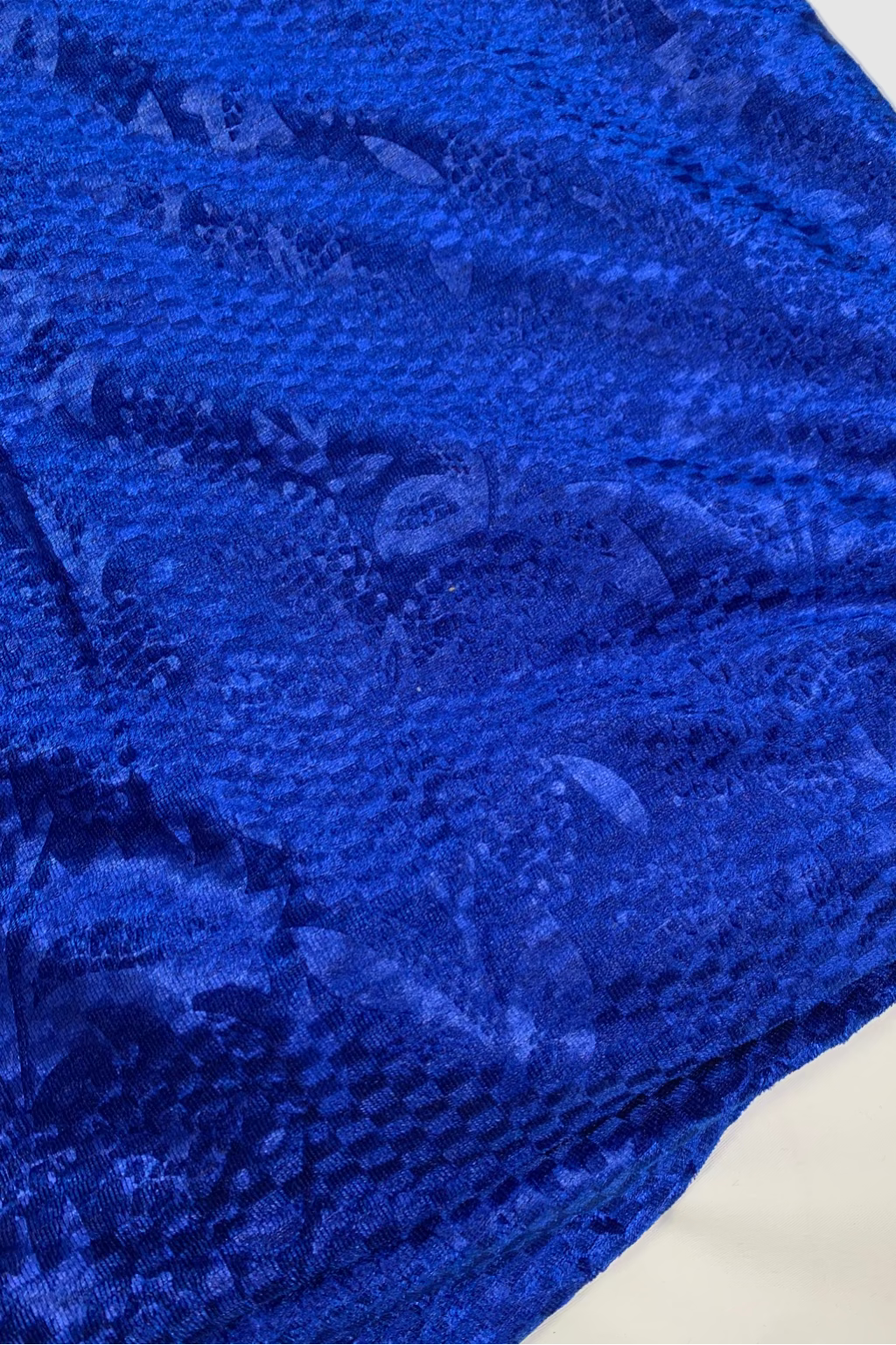 Close-up of a blue textured fabric on a white background