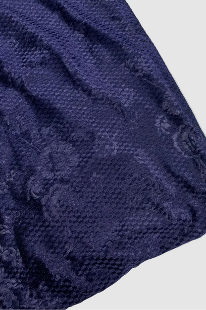 Close-up of a textured blue fabric on a light background