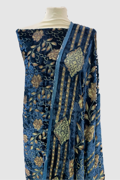Blue floral patterned fabric on a mannequin in a store setting