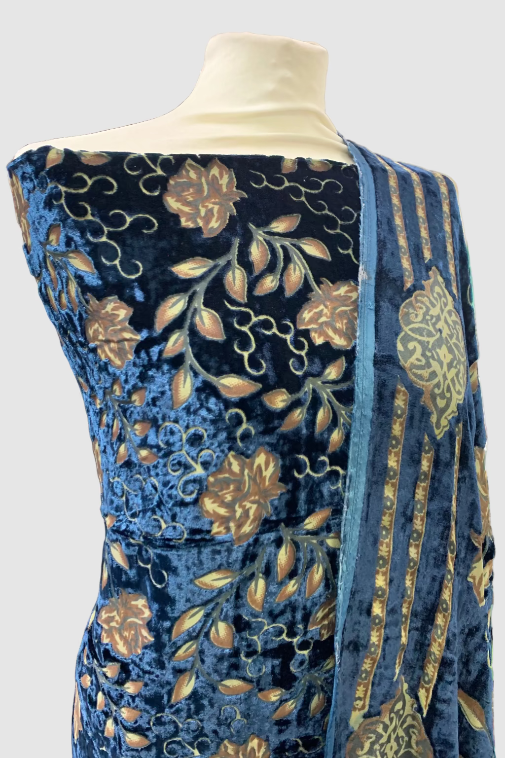 Blue printed garment on a mannequin in a store setting