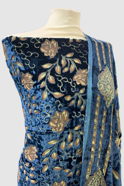 Blue printed garment on a mannequin in a store setting