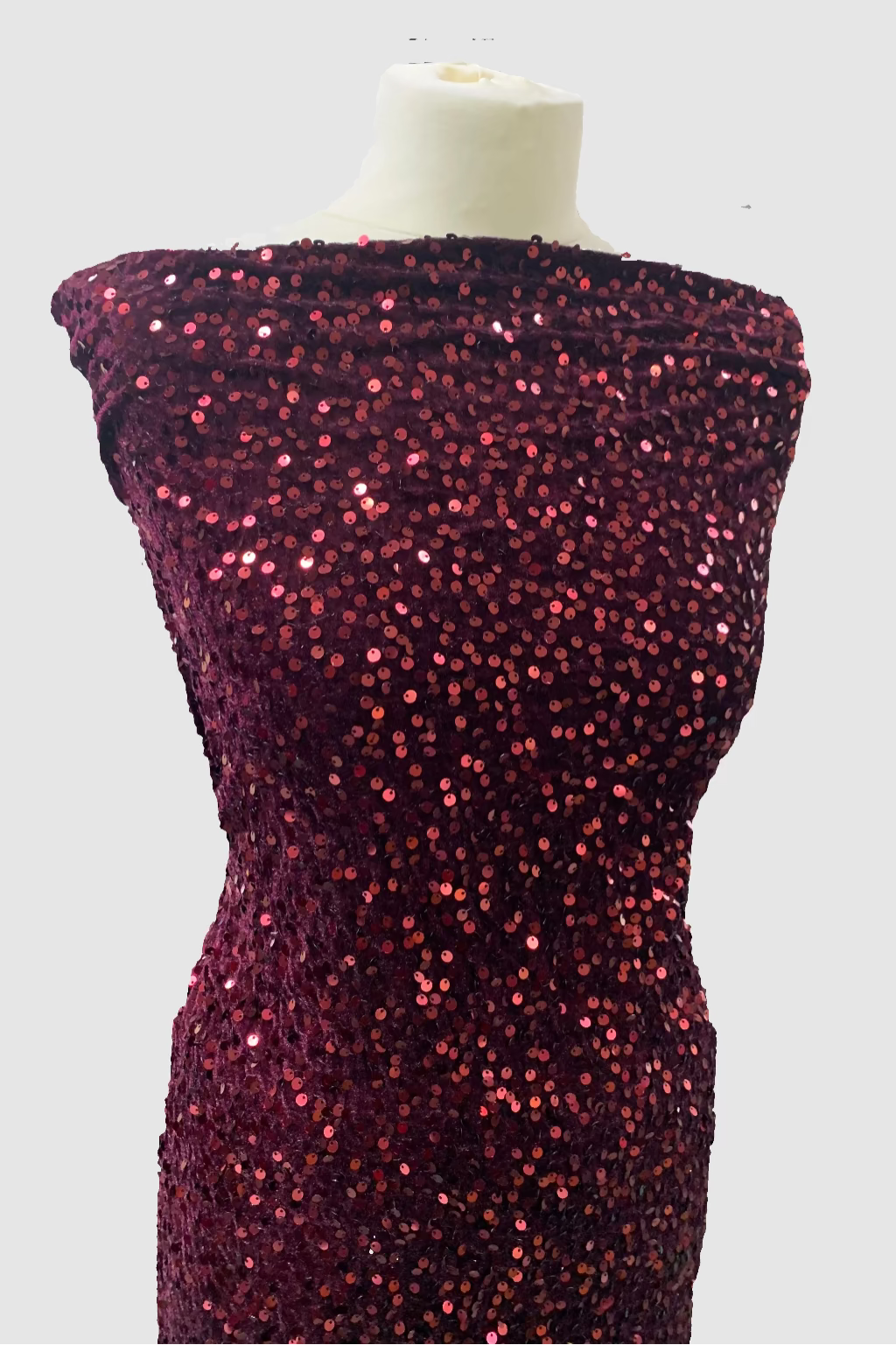Mannequin wearing a burgundy sequin dress in a fabric store