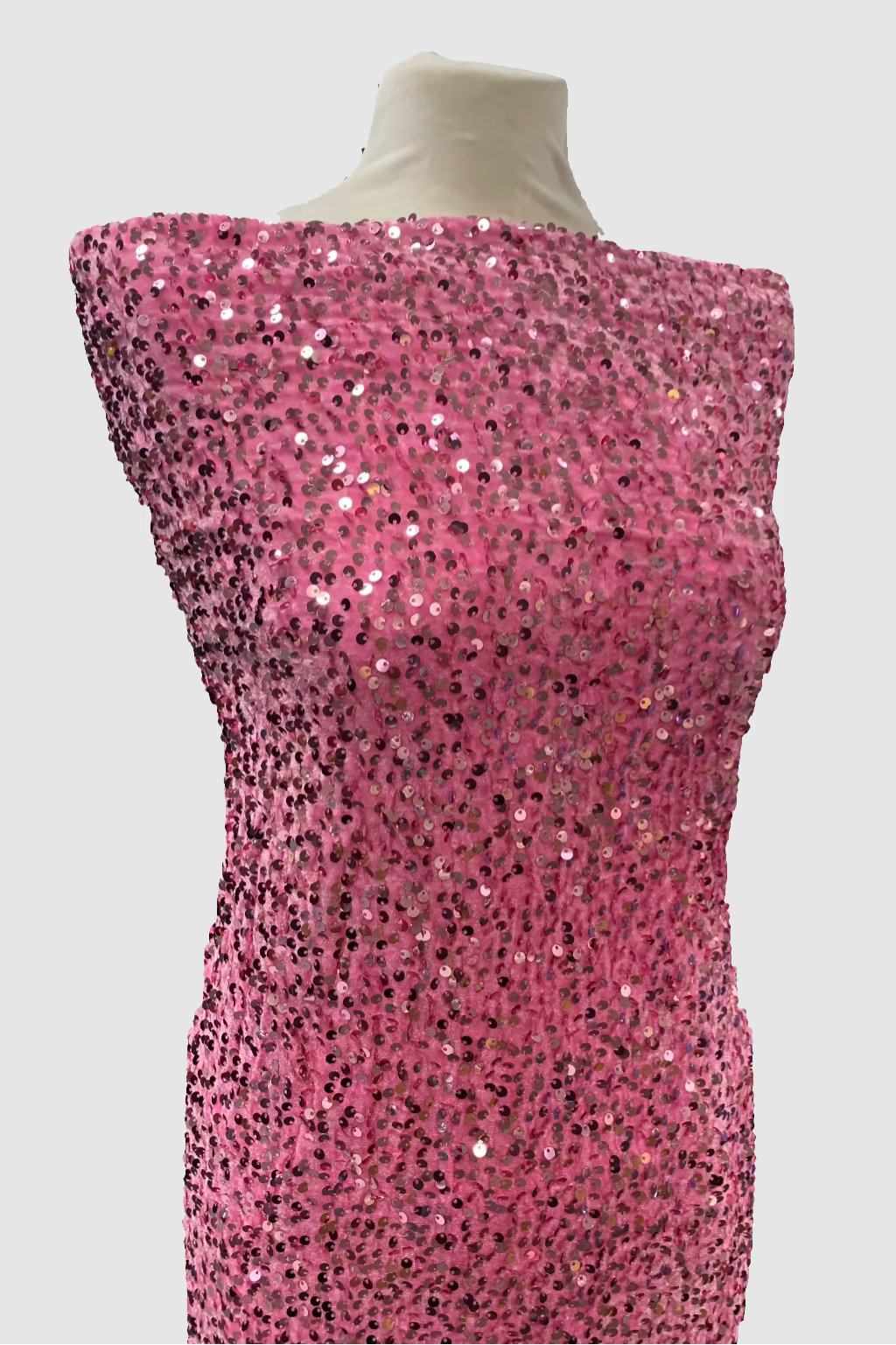 Mannequin wearing a pink sequin dress in a store setting