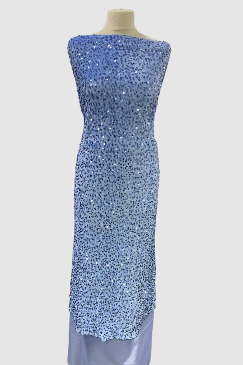 Mannequin wearing a blue sequined dress in a fabric store