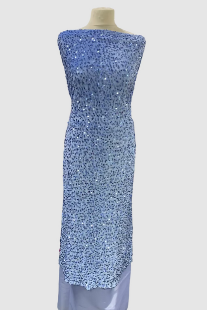 Mannequin wearing a blue sequined dress in a fabric store