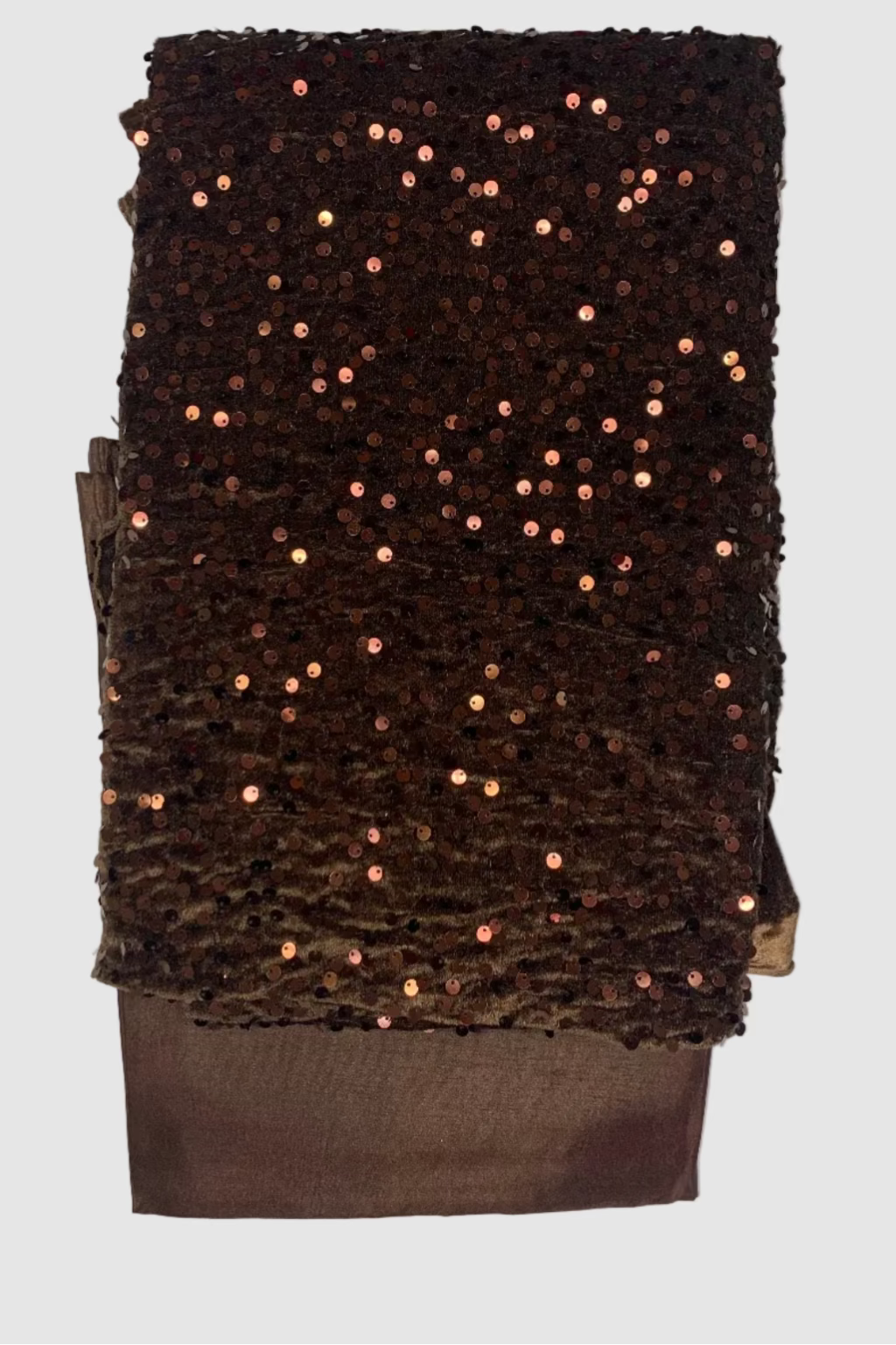 Brown sequin velvet fabric on a white background