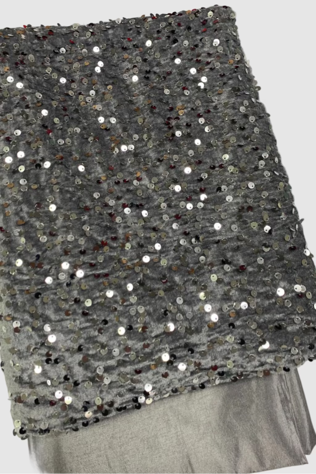 Silver fabric with sequins on a white background