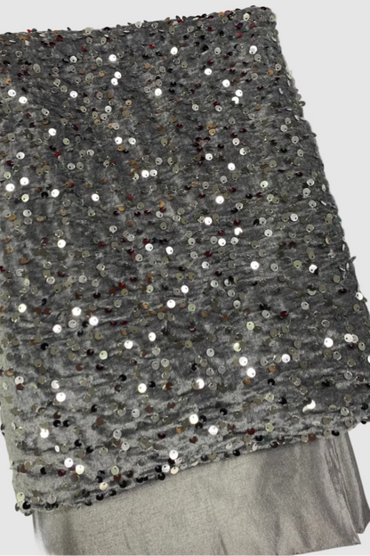 Silver fabric with sequins on a white background