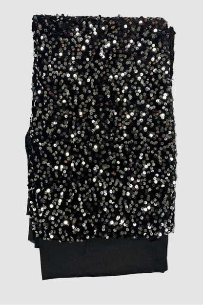 Black velvet fabric with silver sequins on a white background