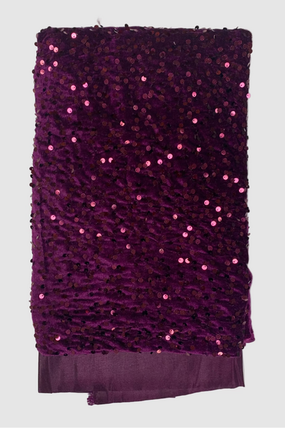 Purple fabric with sequins on a white background