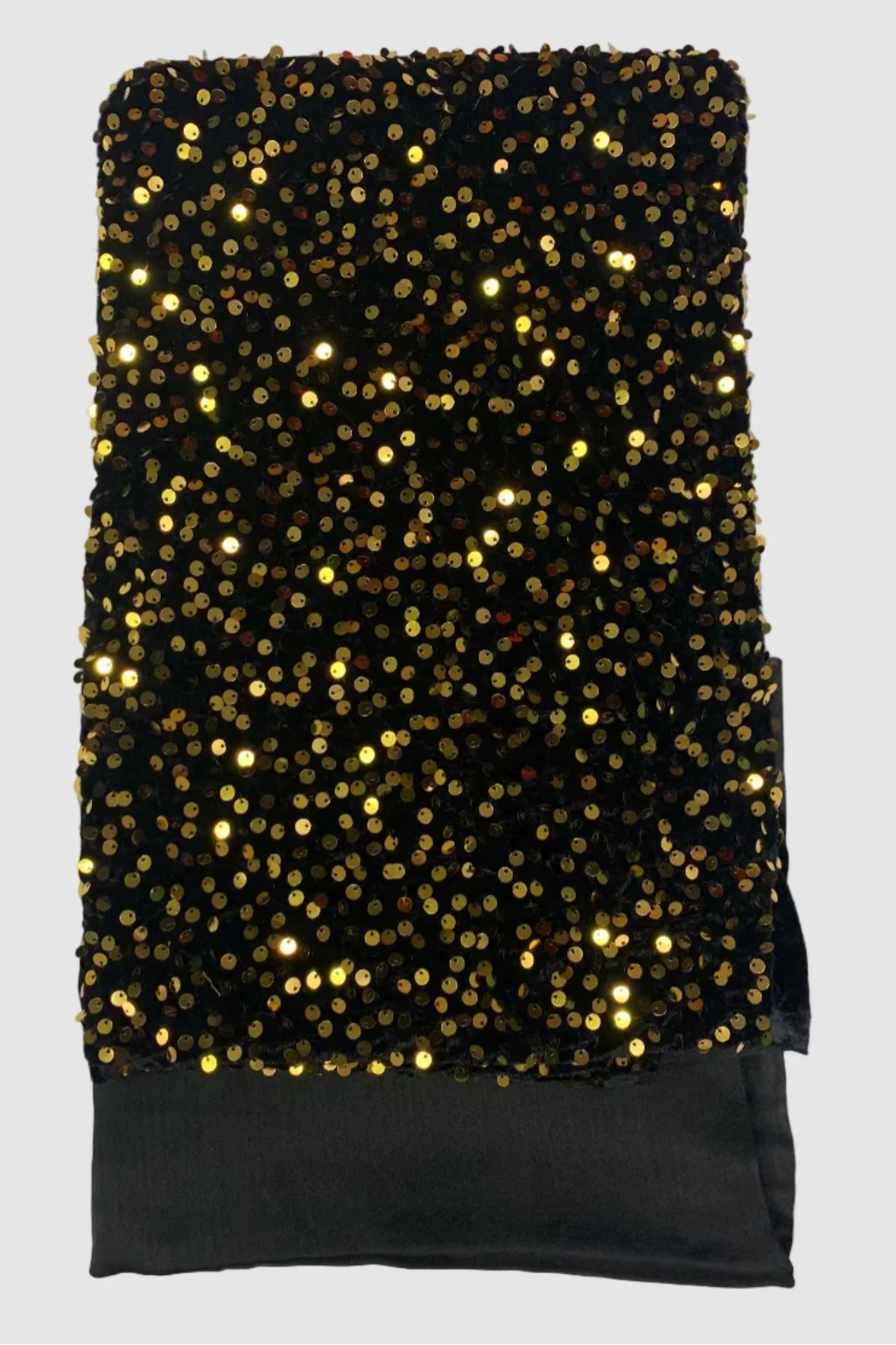 Black fabric with gold sequins on a white background