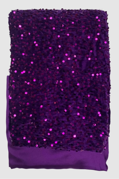 Purple sequined fabric on a white background