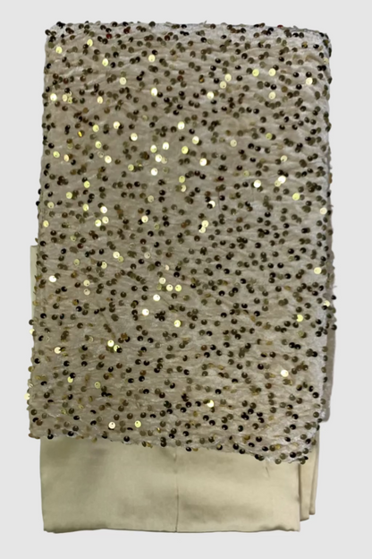 Beige fabric with gold sequins on a white background