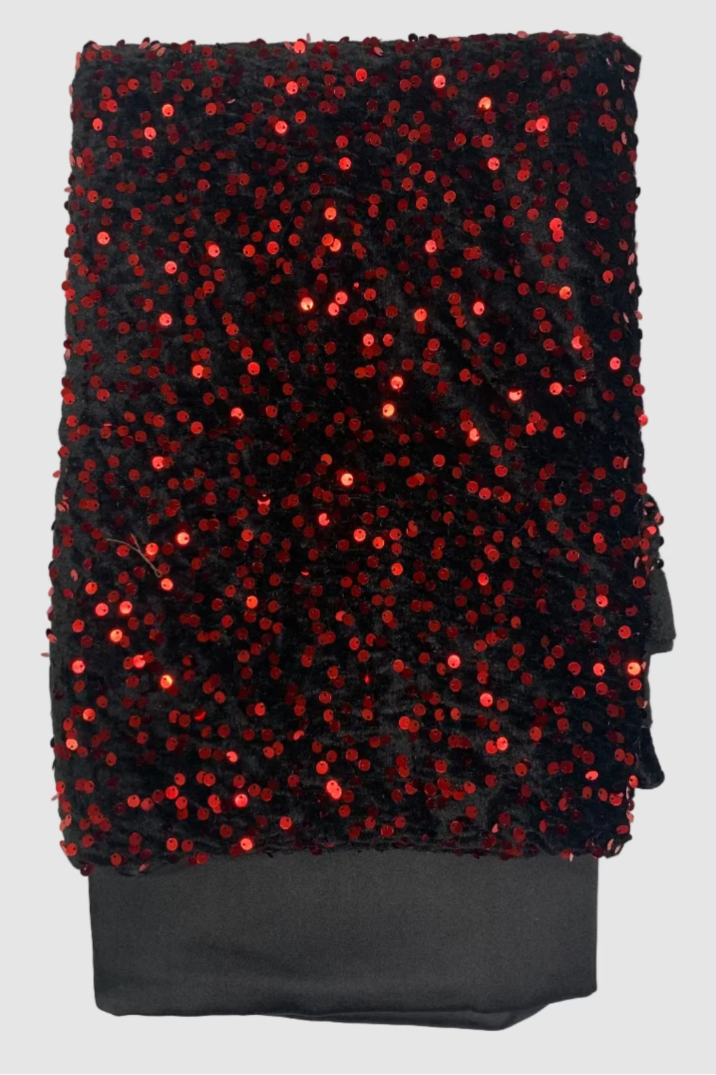 Black fabric with red sequins on a white background