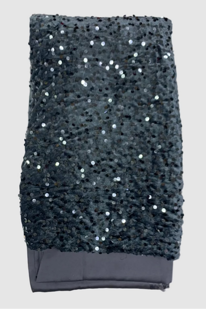 Grey sequin velvet fabric on a white background