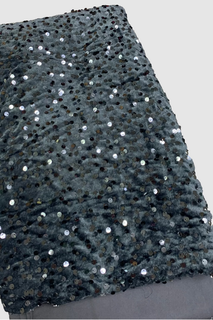 Grey sequin velvet fabric on a white background