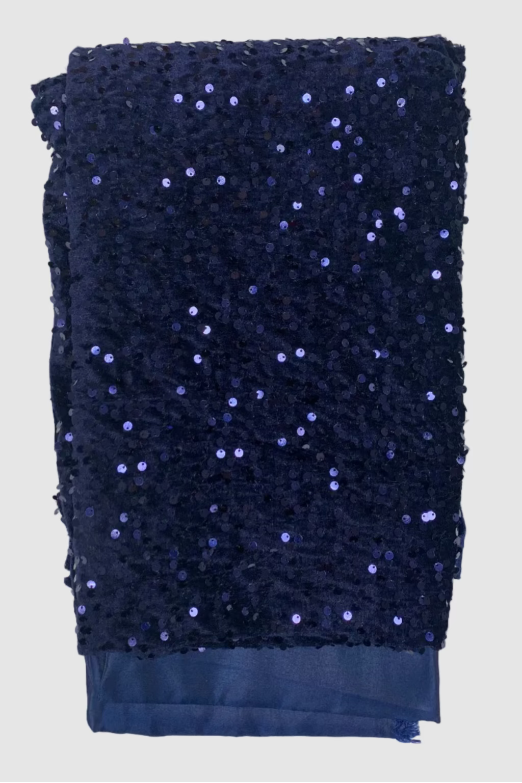 Navy blue sequined fabric on a white background