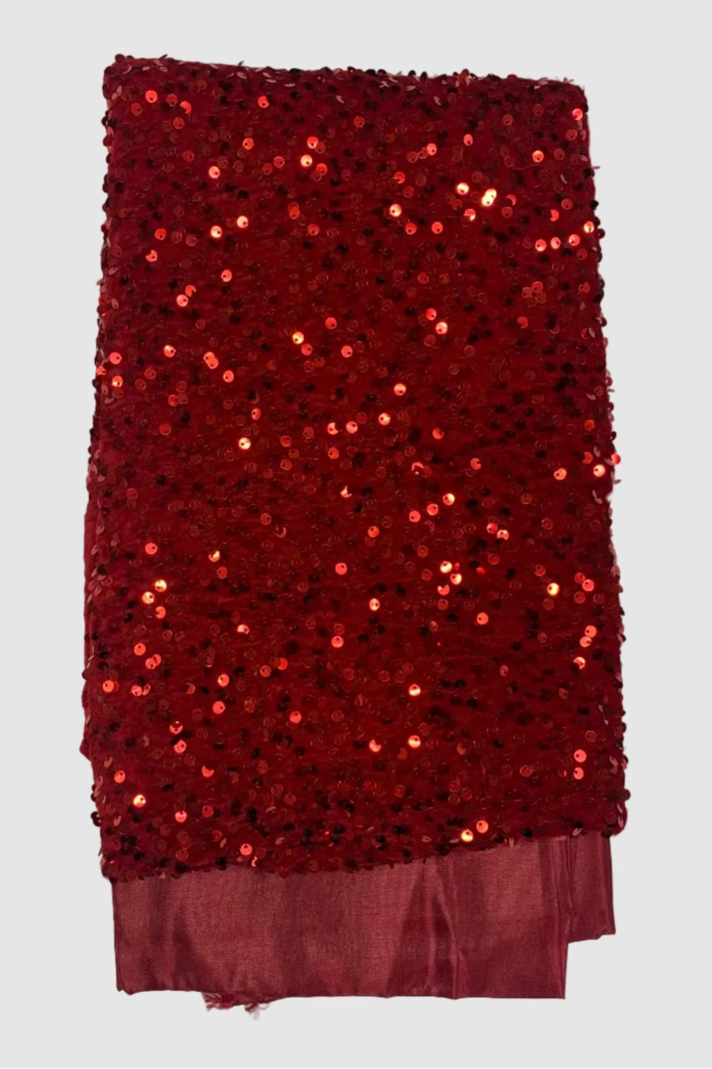 Red sequin fabric on a white background