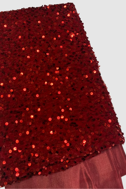 Red sequin fabric on a white background