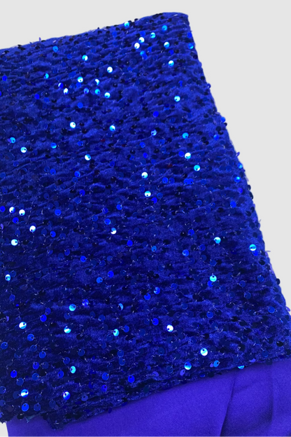 Blue velvet fabric with sequins on a white background