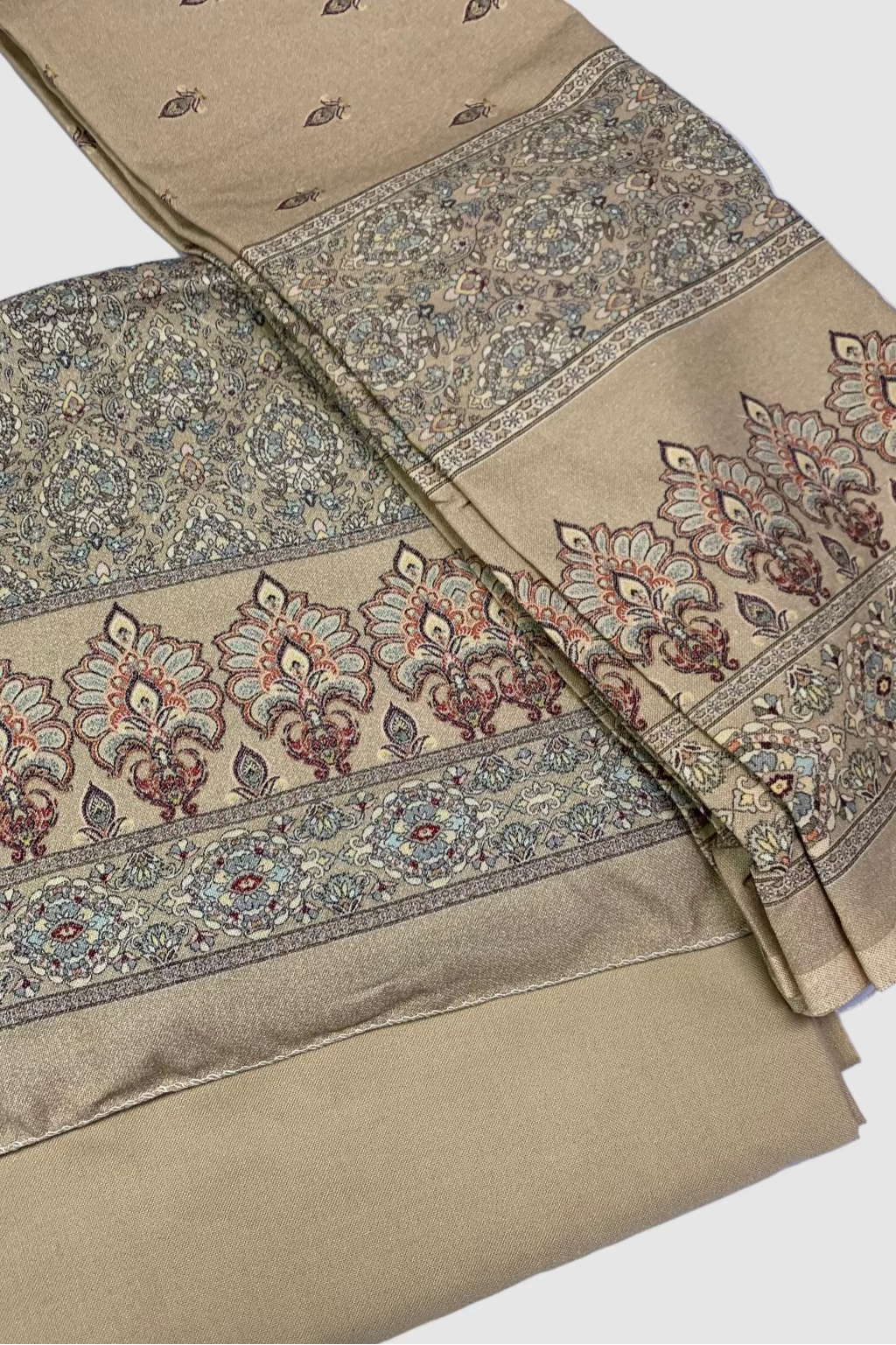 Gold fabric with intricate patterns on a white background