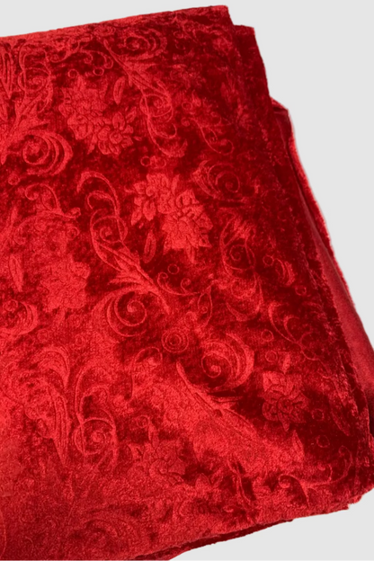 Red patterned fabric on a white background