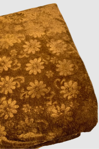 Brown fabric with floral pattern on a white background