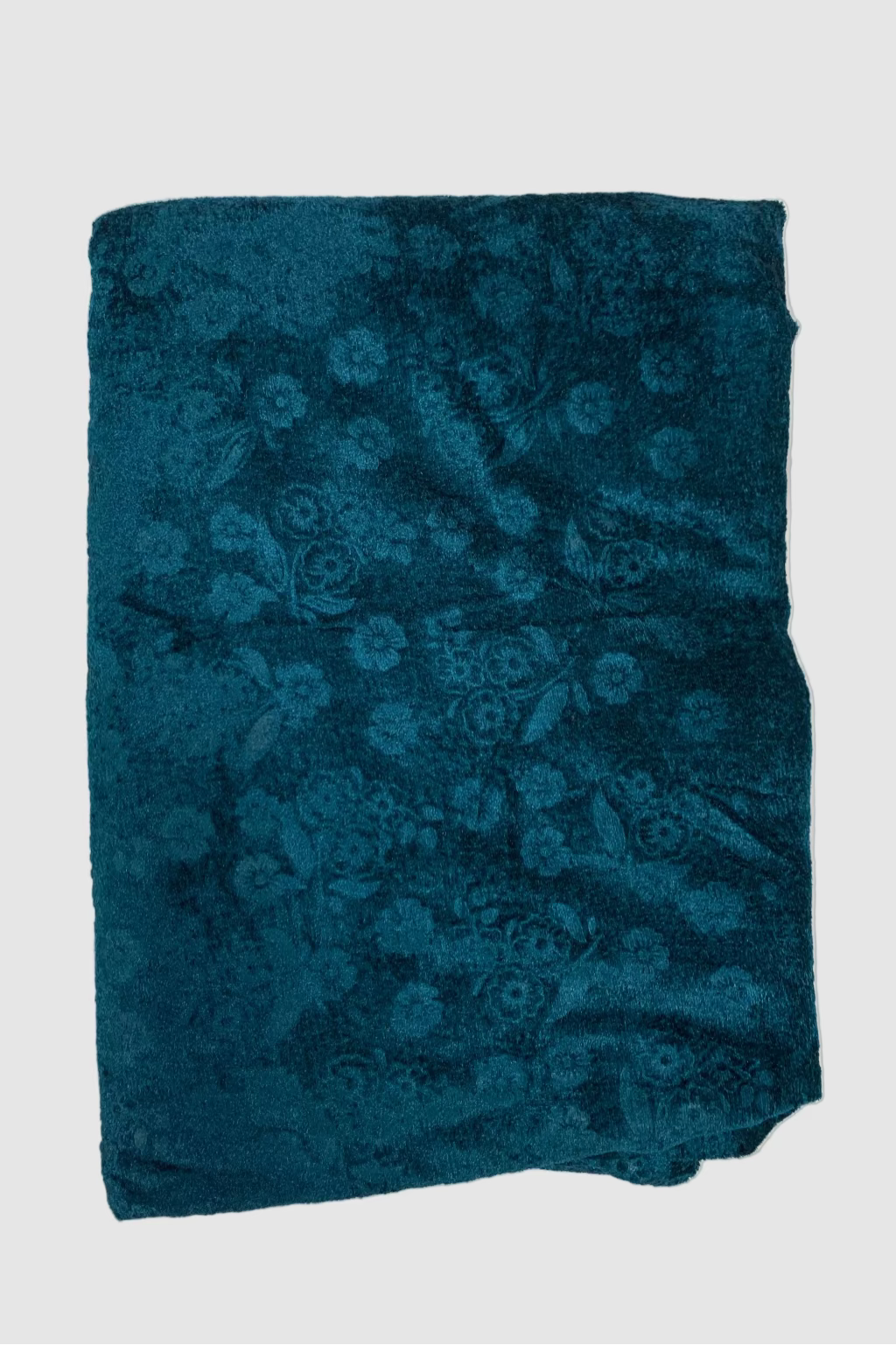 Blue floral-patterned fabric on a white background