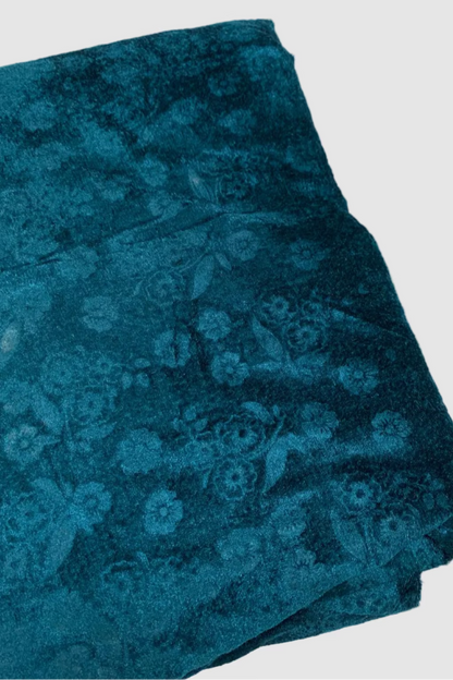 Blue floral patterned fabric on a white background