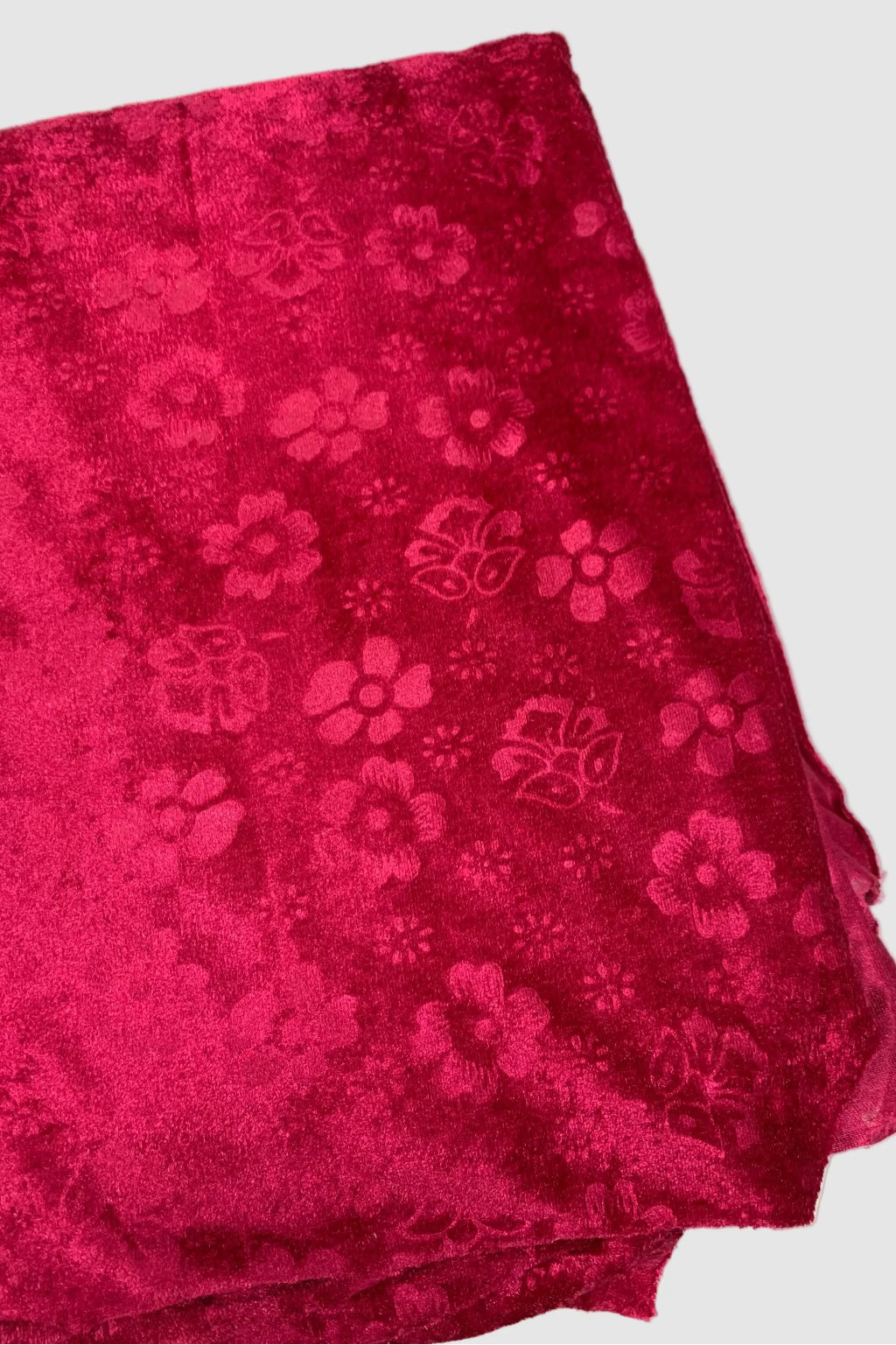 Pink fabric with floral pattern on a white background