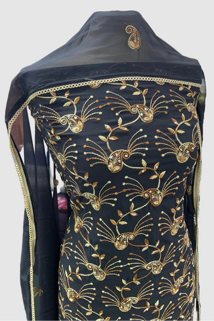 Navy Blue fabric with gold embroidery on a mannequin in a store setting
