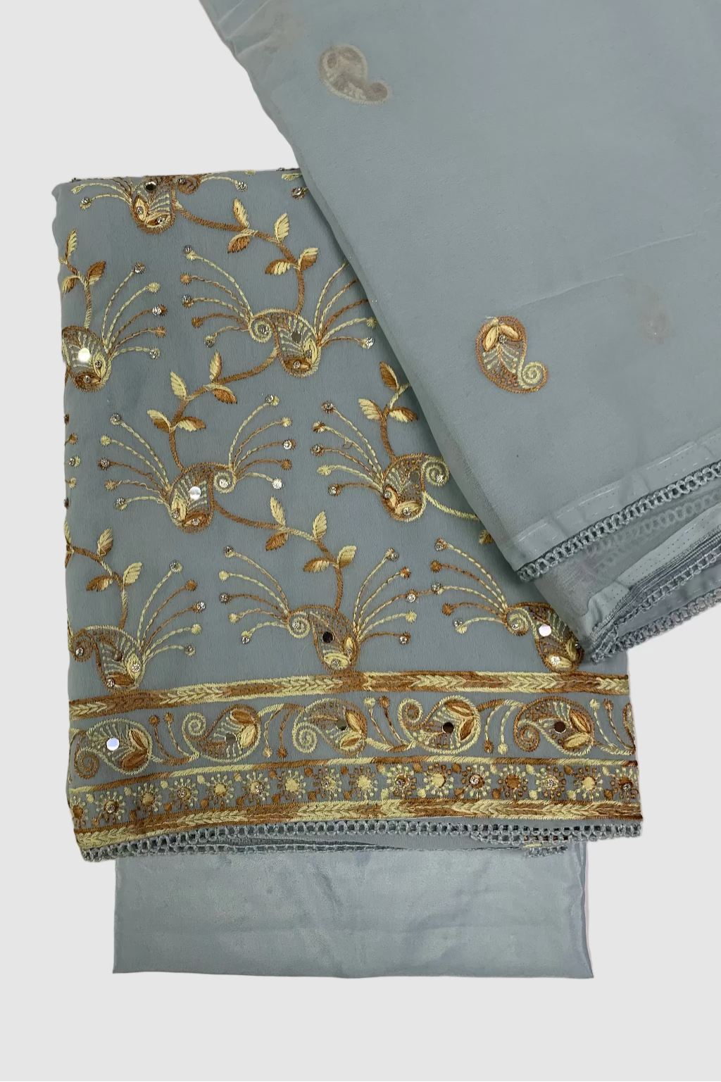 Light blue fabric with gold embroidery on a beige background