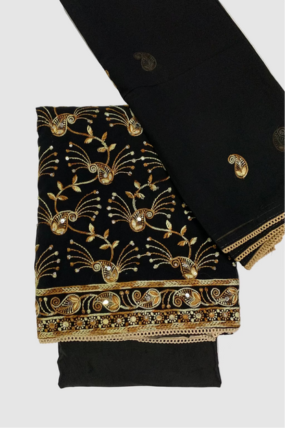 Black fabric with gold embroidery on a white background