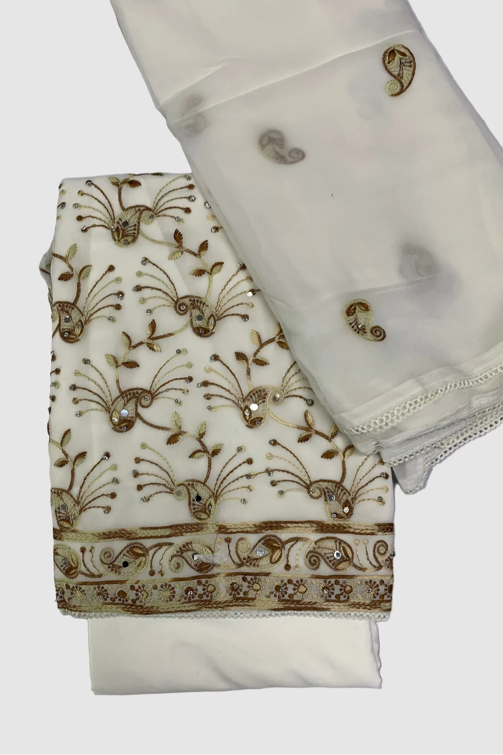 White fabric with gold embroidery on a gray background