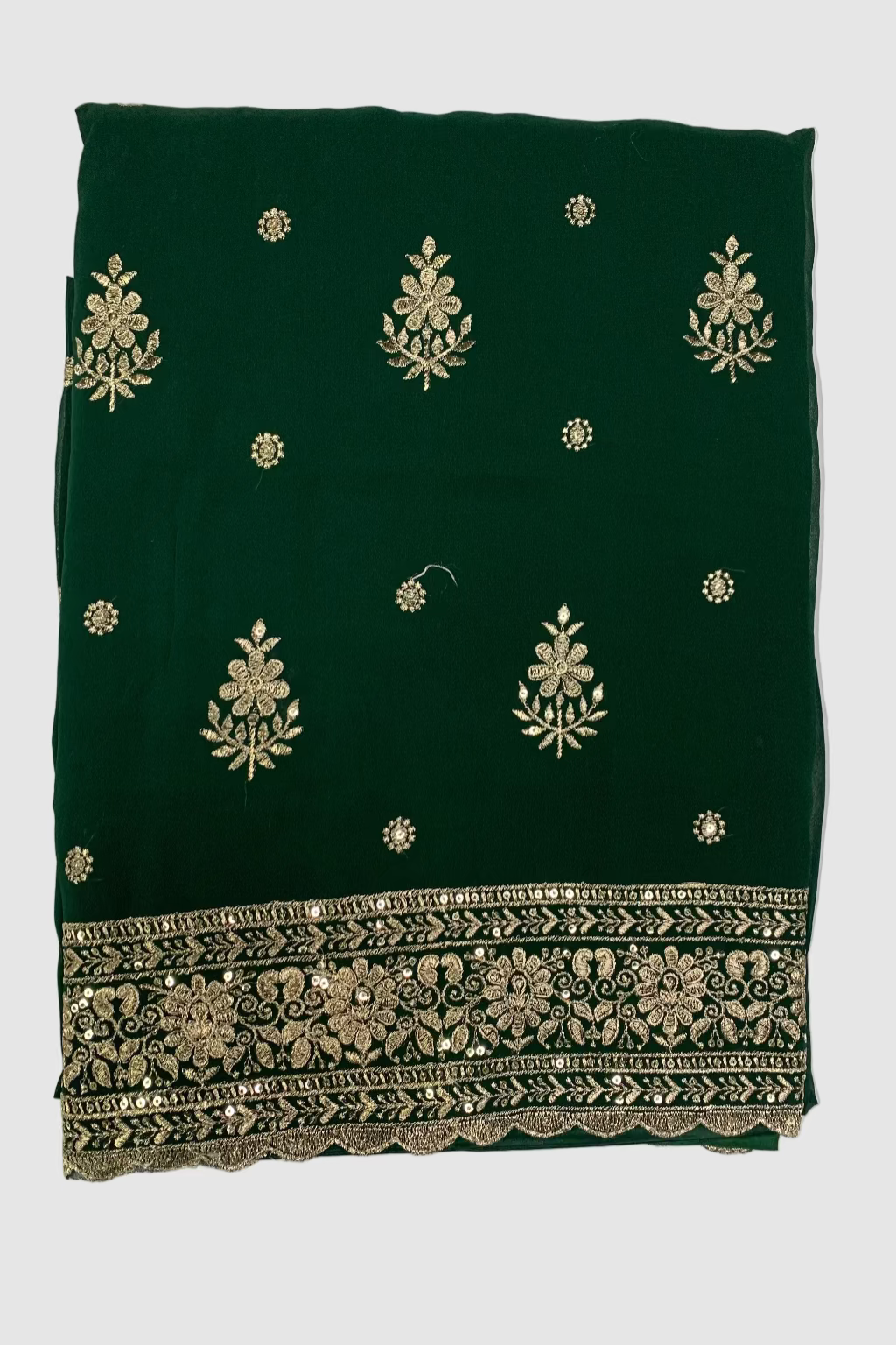 Green fabric with gold embroidery on a white background