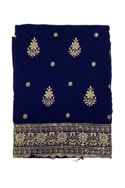 Blue fabric with gold floral embroidery on a light white background