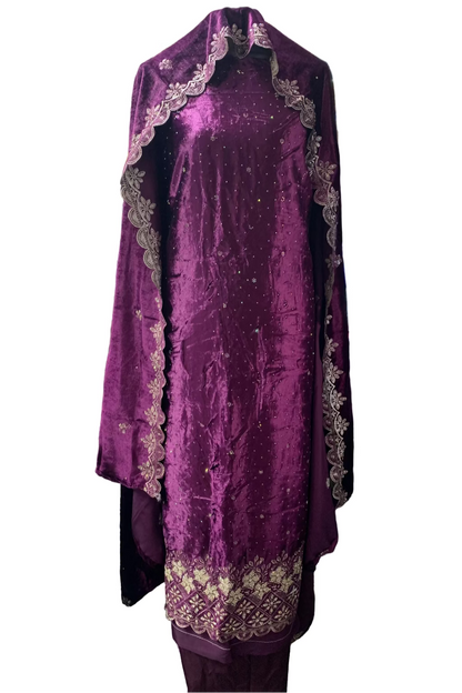 Purple embroidered garment on a hanger in a store setting