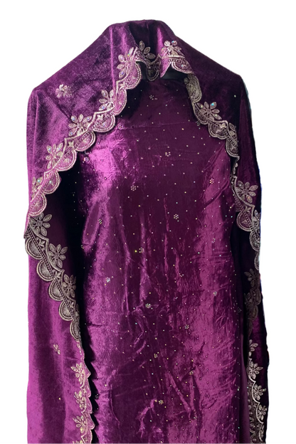 Purple embroidered fabric on a mannequin in a store setting