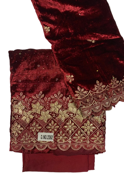 Maroon fabric with gold embroidery on a white background