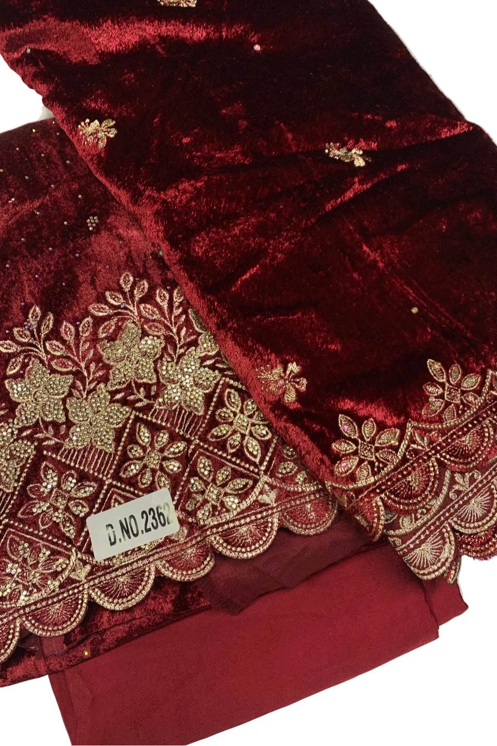 Maroon fabric with gold embroidery on a white background