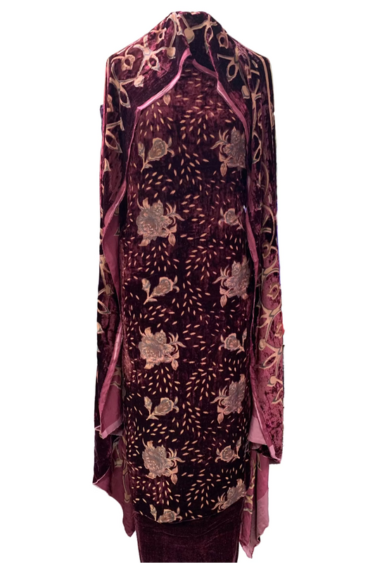 Traditional velvet garment in a store setting