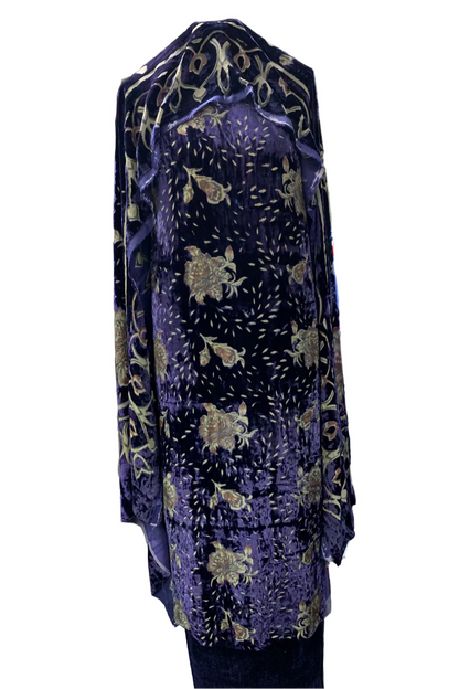 Blue velvet garment in a store setting