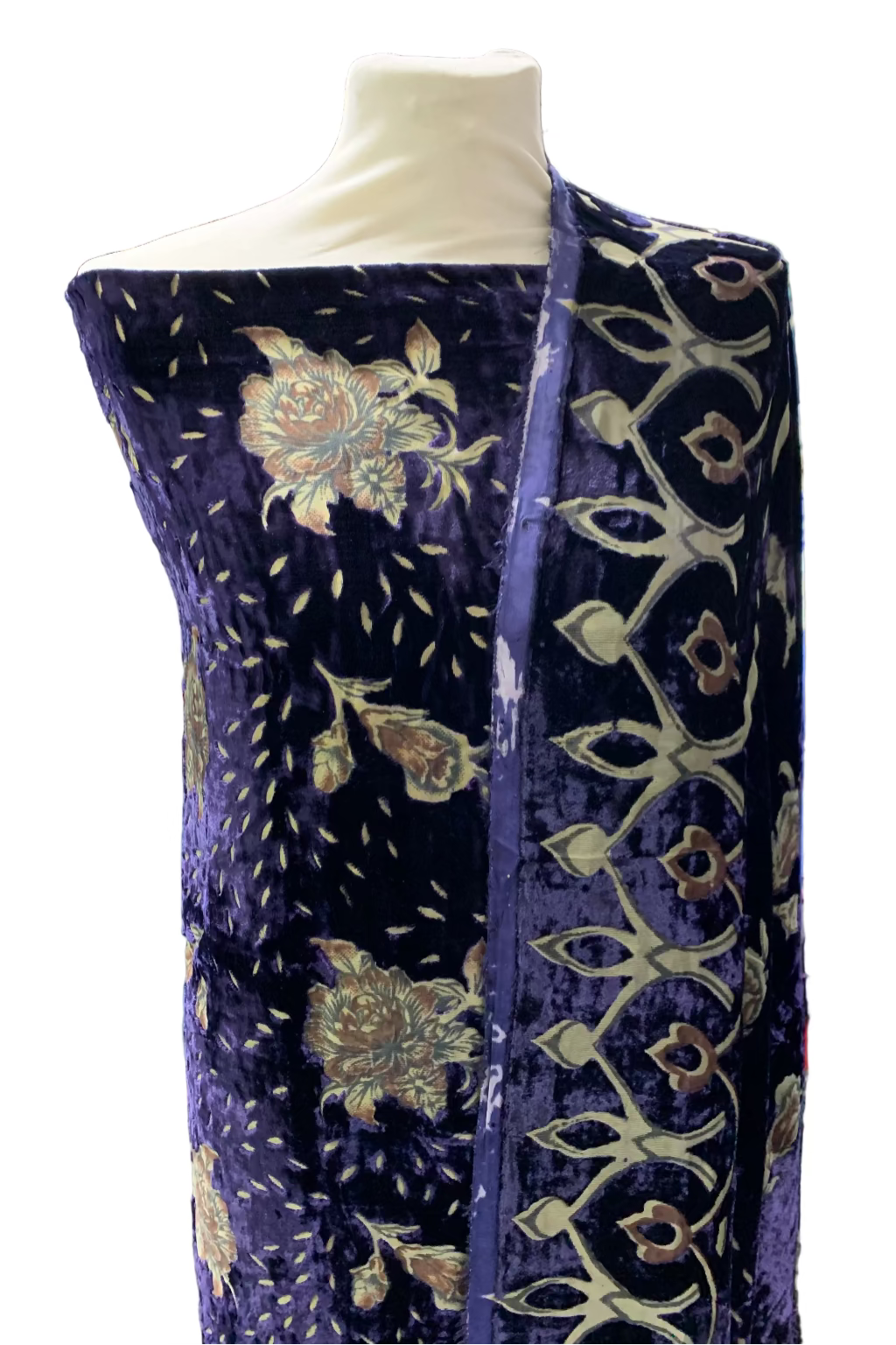 Blue velvet fabric on a mannequin in a store setting