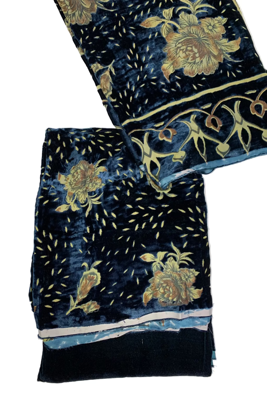 Turquoise velvet fabric with gold floral patterns on a white background