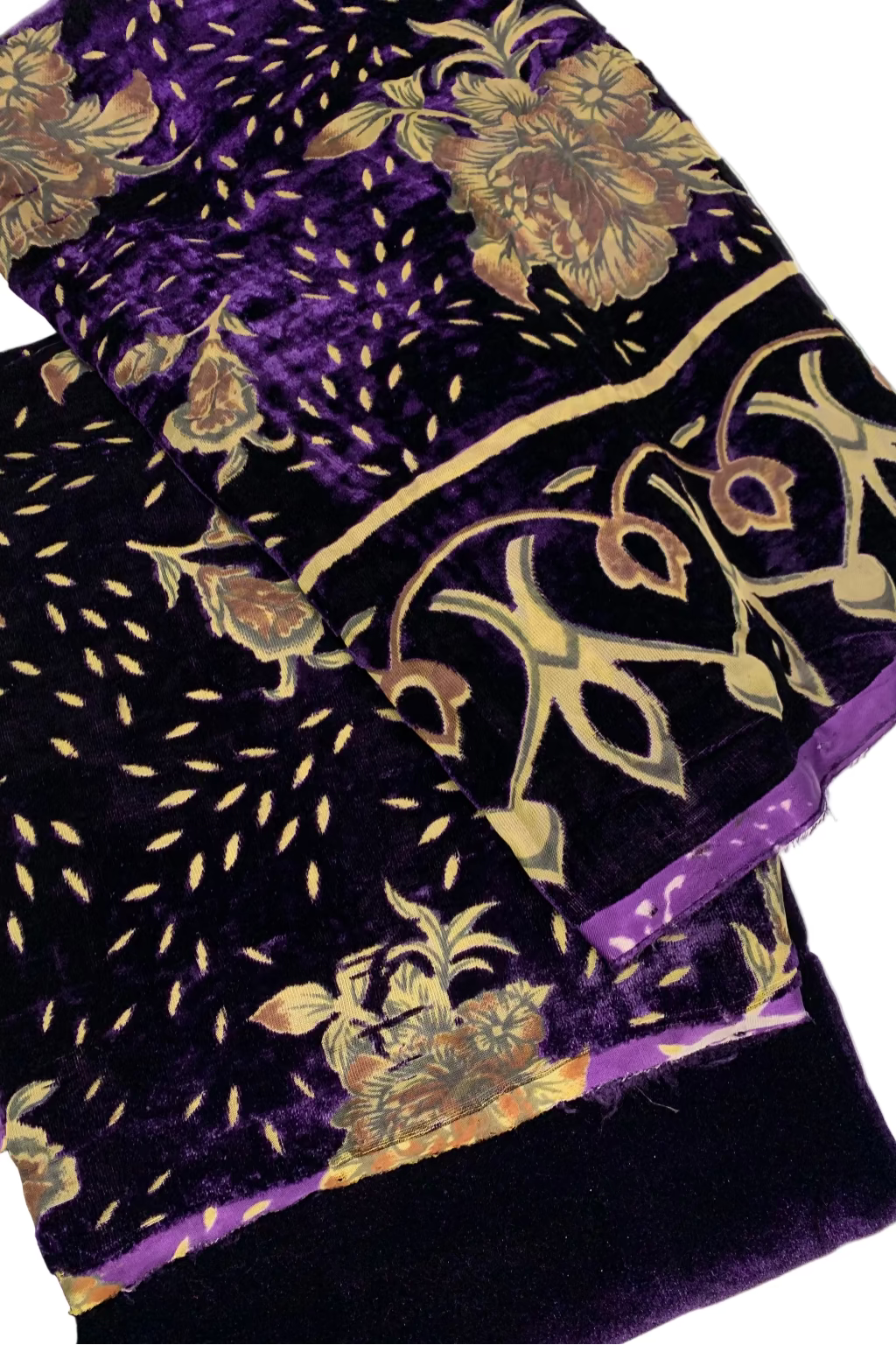 Purple fabric with floral patterns on a white background