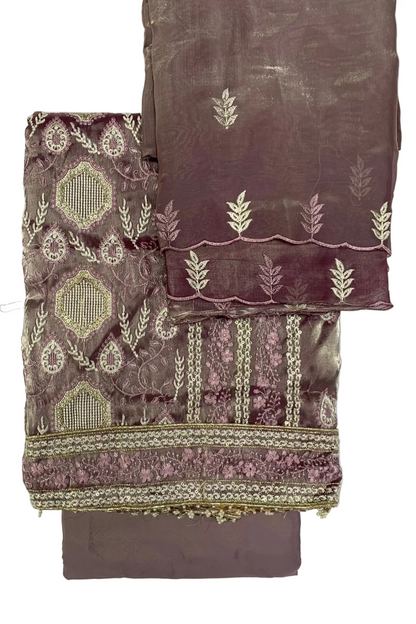 Folded fabric with intricate patterns on a white background