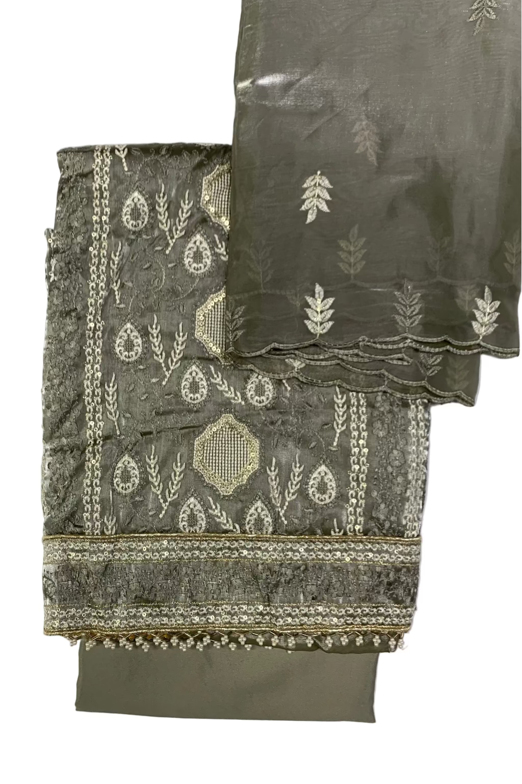 Grey embroidered fabric with white patterns on a light gray background