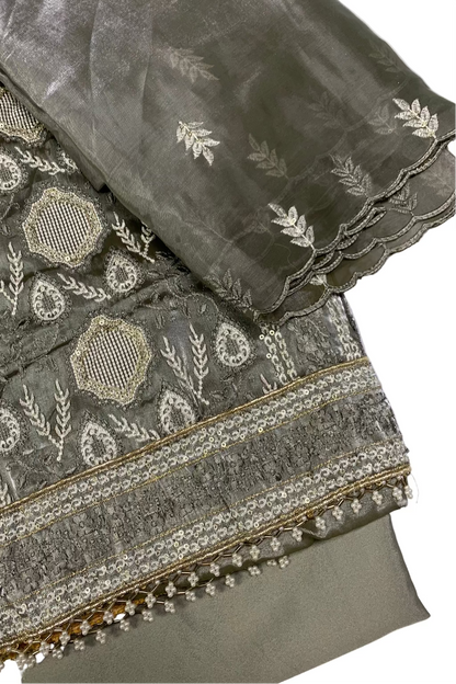 Embroidered fabric with intricate patterns on a white background