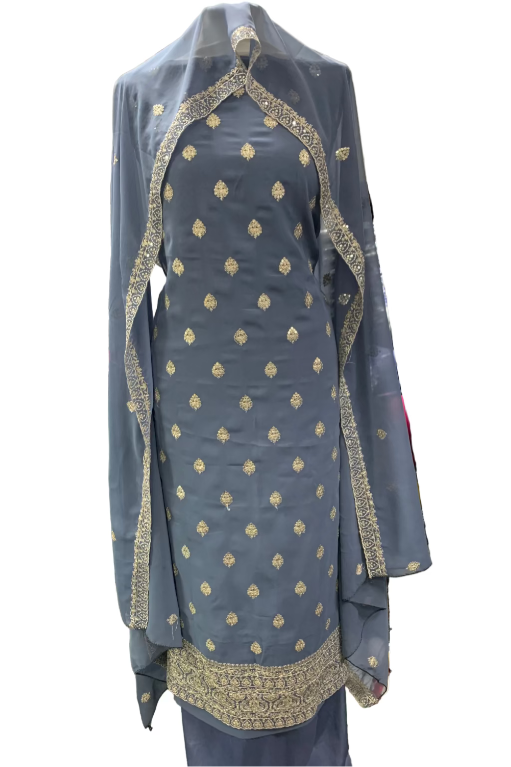 Grey embroidered outfit on a mannequin in a store setting